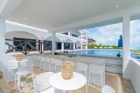 Brand New 12 Suite Villa  directly on the waters edge of the Caribbean Sea - Villas
