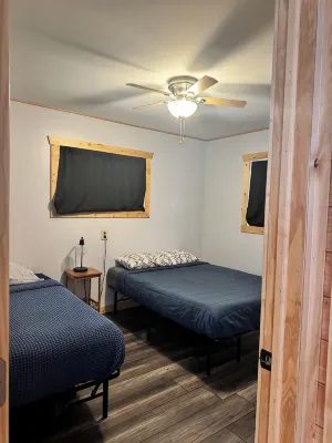 Charming 2-bedroom cottage with WiFi, AC on quiet lake on trails with kayaks. - 2-Star