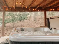 Cozy Cabin in woods with Hot Tub, Porch Swing Bed and Fire Pit in Aska Adventure - 3-Star