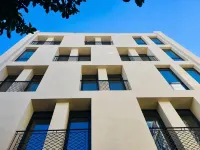 Urban Nest - Suites & Apartments Отели в г. 