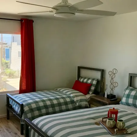 Steps to sand! Ocean view, Walk to village, family friendly, A/C!