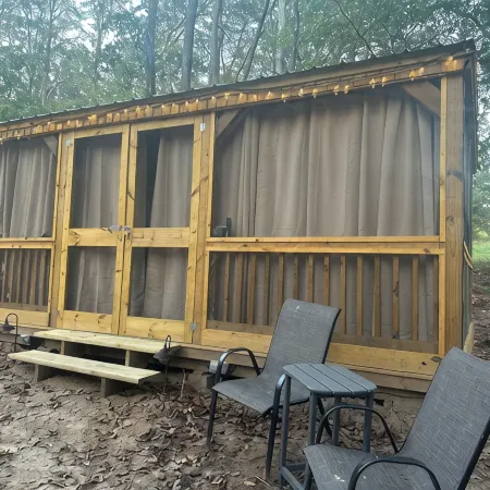 Mentone glamping getaway in a private screened in cabin in charming Mentone