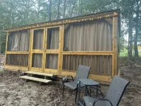 Mentone glamping getaway in a  private screened in cabin in charming Mentone