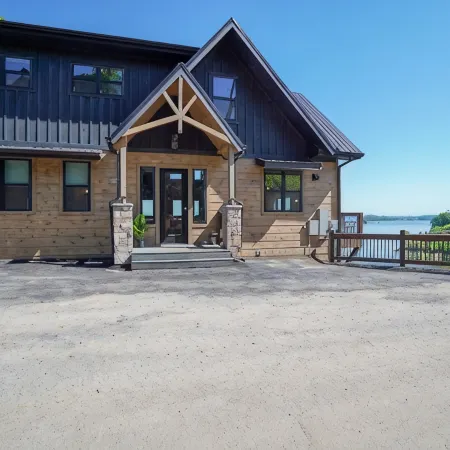 Lakefront home with retro accents, private pool, and private dock.