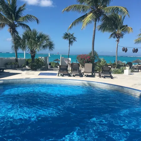 Walk Out of this Elegant 2 Bedroom Condominium On To Stunning Grace Bay Beach!