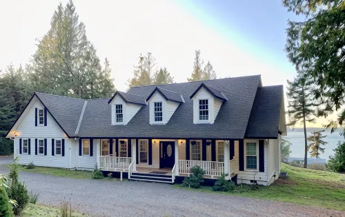 Amazing sunsets!! Water view, hot tub, close to town, fire pit. - 3-Star