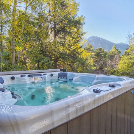 Dreamy home on river, mountain views, steps from town.