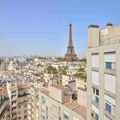 Designer Stay — Direct Eiffel Tower View + A/C Hotel Exterior