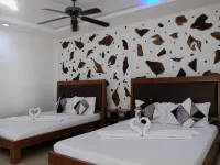 Sundown Resort & Austrian Pension House Hotel dekat Pantai Cagban