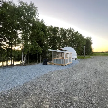 Cozy lakeside glamping dome with fireplace, AC and full bath.