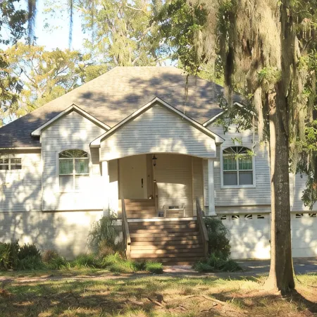 Elegant WATERFRONT home with private boat ramp/dock, elevator, & unmatched view!