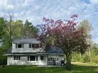 Charming house on the St. Mary's river in Sault Ste. Marie, freighters out front