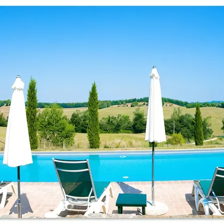 Tuscan village in SIena. farmhouse surrounded by garden,pool and panoramic view