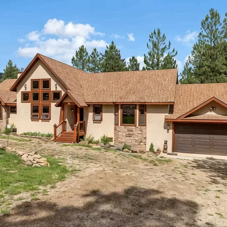 Luxury home on the golf course with spacious deck overlooking the mountains