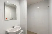 Grey Toned 1BR Apartment Tamansari Skylounge Makassar By Travelio - Apartments