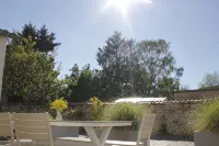 "Brunnenhaus": Stylish vacation home with Mediterranean courtyard and huge garden - Homestays