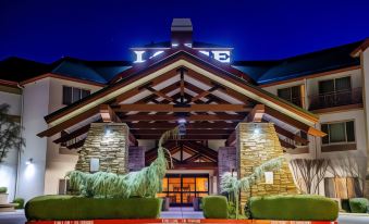"a large building with a wooden roof and the word "" hotel "" lit up on it" at Lodge at Feather Falls Casino