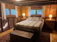 Renovated 3-BR boathouse built atop water in quiet cove; private float & trails - Wifi