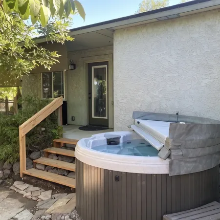 Cozy Cottage with Private Backyard.  Fire Pit, Hot Tub, Bikes, and Paddleboards