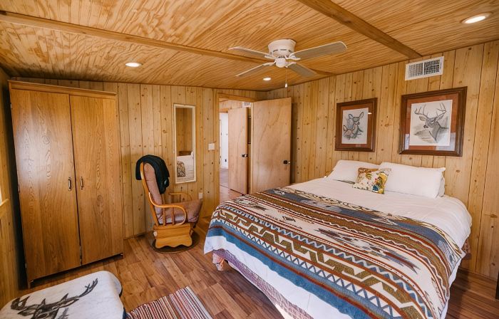 Beautiful Cabin Nestled in a Peaceful Wooded Setting with a Scenic Pond.