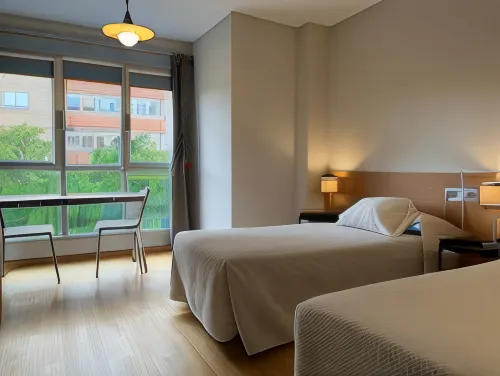 Apartamentos León - Condos