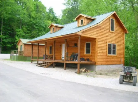 3BR, 1 Bath Cabin with hot tub, full kitchen, and living room.