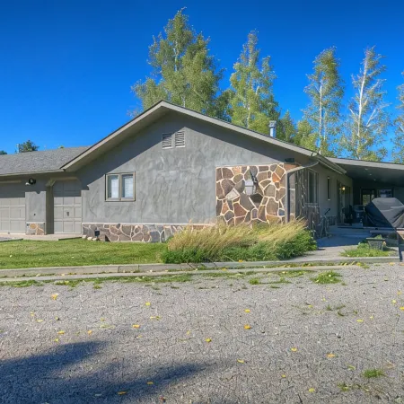 Luxury Home on Blue Ribbon Madison River and steps away from downtown Ennis, MT.