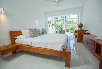 Award-Winning Beachfront VillaSleeps 28  • Full Staff • Pool Spa Private Beach
