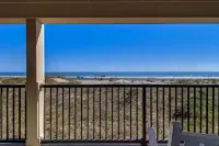 Beach Style Condo Includes Google Mini Home and Beach Access 2 Bedroom Condo by RedAwning