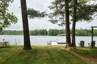 NEW! Renovated Bungalow steps from Lake Tomahawk - King Bed, Dock Space, Firepit