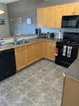 Spacious 4-bedroom townhome in charming Red Deer with WiFi, AC