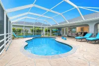 Newly Remodeled 4BR/3BR Canal Front Retreat w/ Pool Near Golf Course & Beach FL - 4-Star