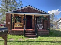 Updated bungalow with screened in porch  in rear.