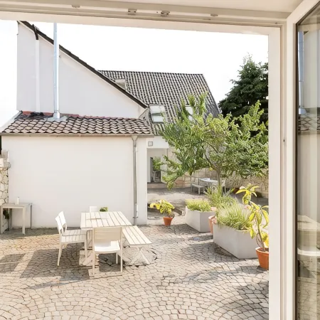 "Brunnenhaus": Stylish vacation home with Mediterranean courtyard and huge garden