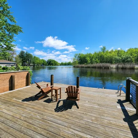 Spacious 4-bedroom waterfront house in Sylvan Beach with private yard and dock.
