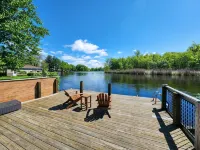 Spacious 4-bedroom waterfront house in Sylvan Beach with private yard and dock.