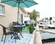 Unique waterfront home, Hot Tub, private boat dock,  walk to beach, pet friendly