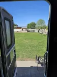Cozy RV tucked back in a quiet property with plenty of room to relax