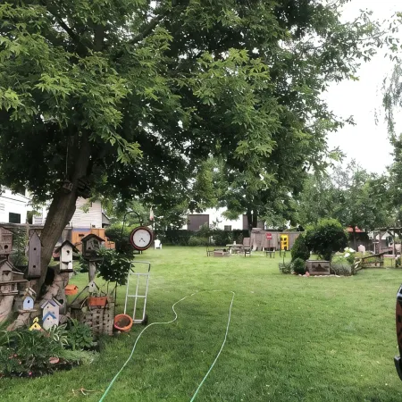 Large Private Fenced Yard with Guest Patio, Fire Pit and Surrounding Gardens.