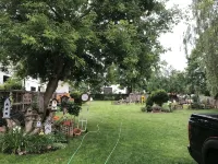 Large Private Fenced Yard with Guest Patio, Fire Pit and Surrounding Gardens.