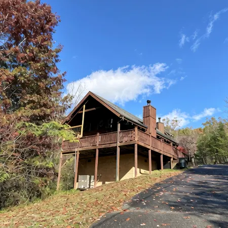 Honeymoon Log Cabin with Heart Shaped Whirlpool Tub & Hot Tub on Covered Porch
