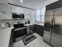 Aquatika Minimalist Beach Escape - Apartments