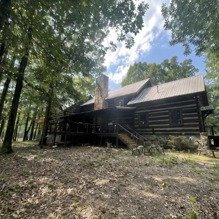 Prospect Mountain Cabin custom log home sportsman's paradise with fishing lake.