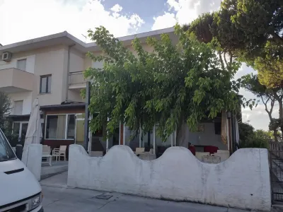 Room in BB - Quadruple Room for a Totally Relaxing Holiday Hotel in zona La Nelide