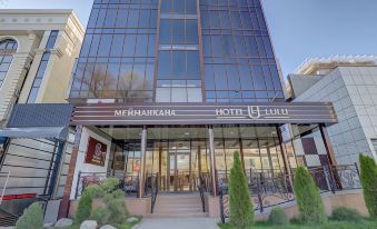 "a large hotel building with a sign that reads "" hotel lula "" prominently displayed on the front of the building" at Hotel Lulu