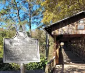 Historic Cabin in a natural setting with waterfalls and covered bridge