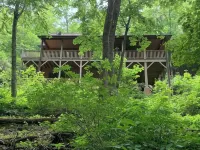 Spacious suite surrounded by nature with living room, fireplace, porch, fire pit