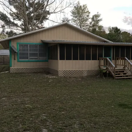 LOTS of parking for vehicles and boats. Large porch with swing and table, chairs