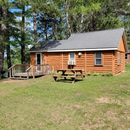 Rustic cabin getaway on the shore of Soo Lake in Phillips, WI