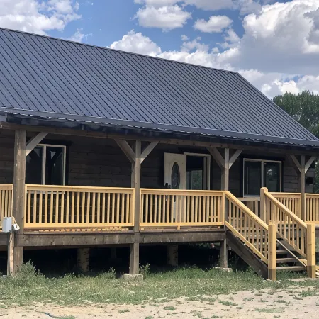 Beautiful hand-crafted log cabin on Horse Creek one block off Main Street.